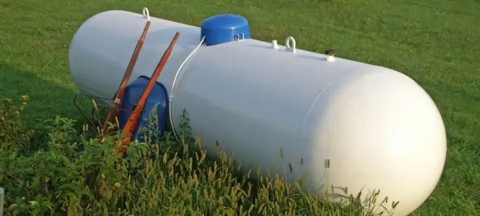 Propane tank surrounded by grass